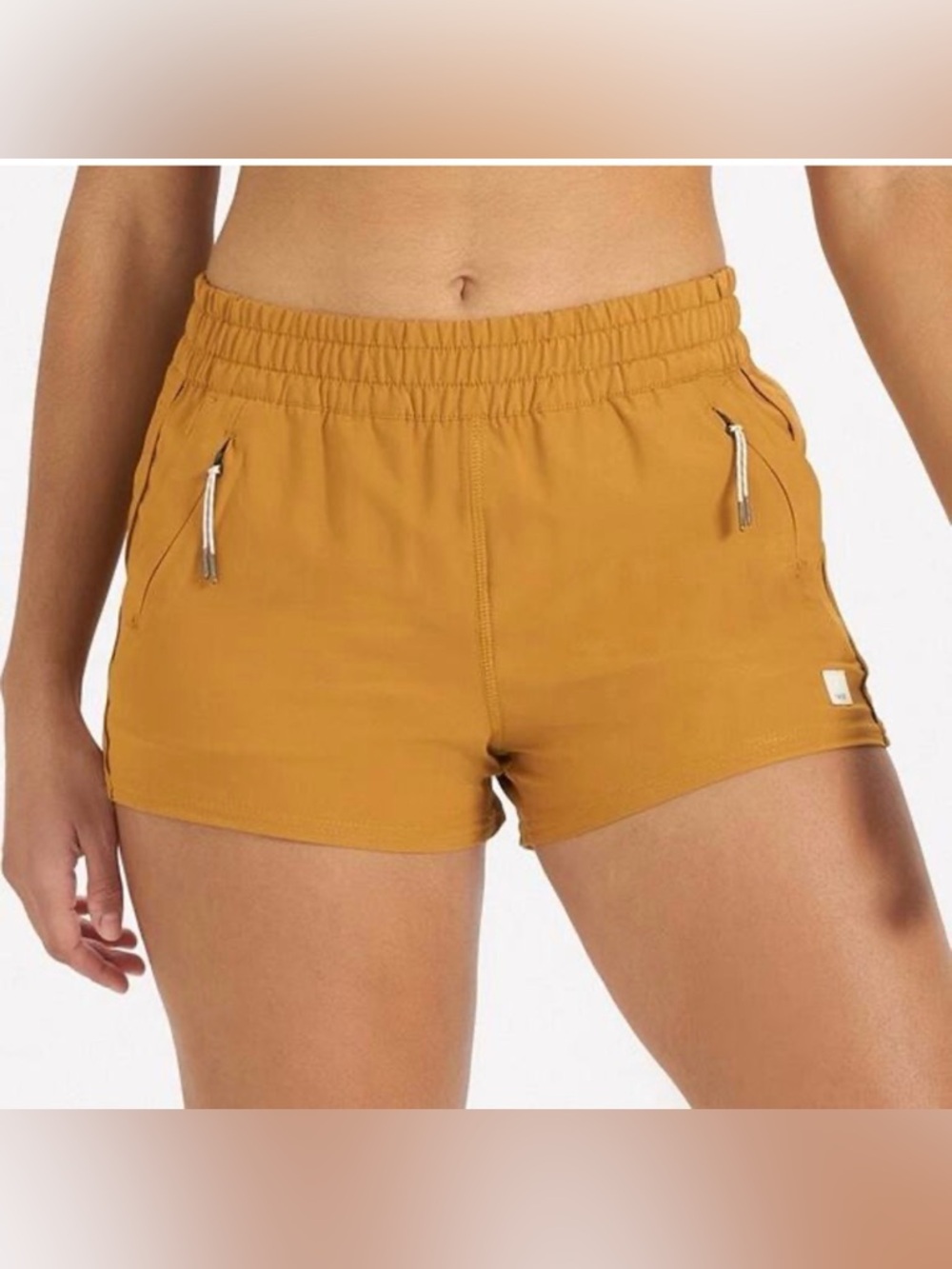 Vuori Dash Performance Shorts in Dark Golden size small